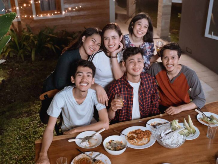 College friend group smiling together
