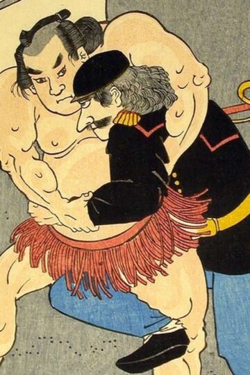 Wrestlers competing in a match